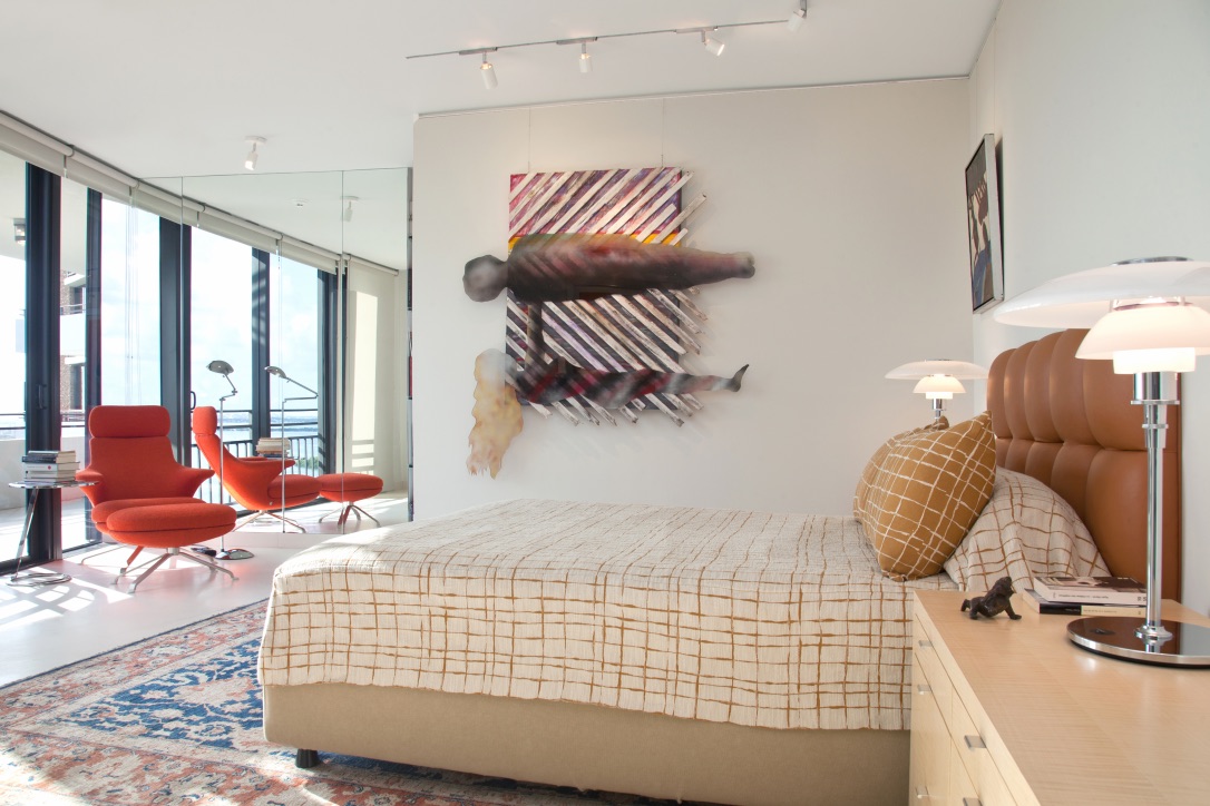 Custom bedroom with quilted leather headboard and nightstands with various drawers in sycamore by Kevin Gray