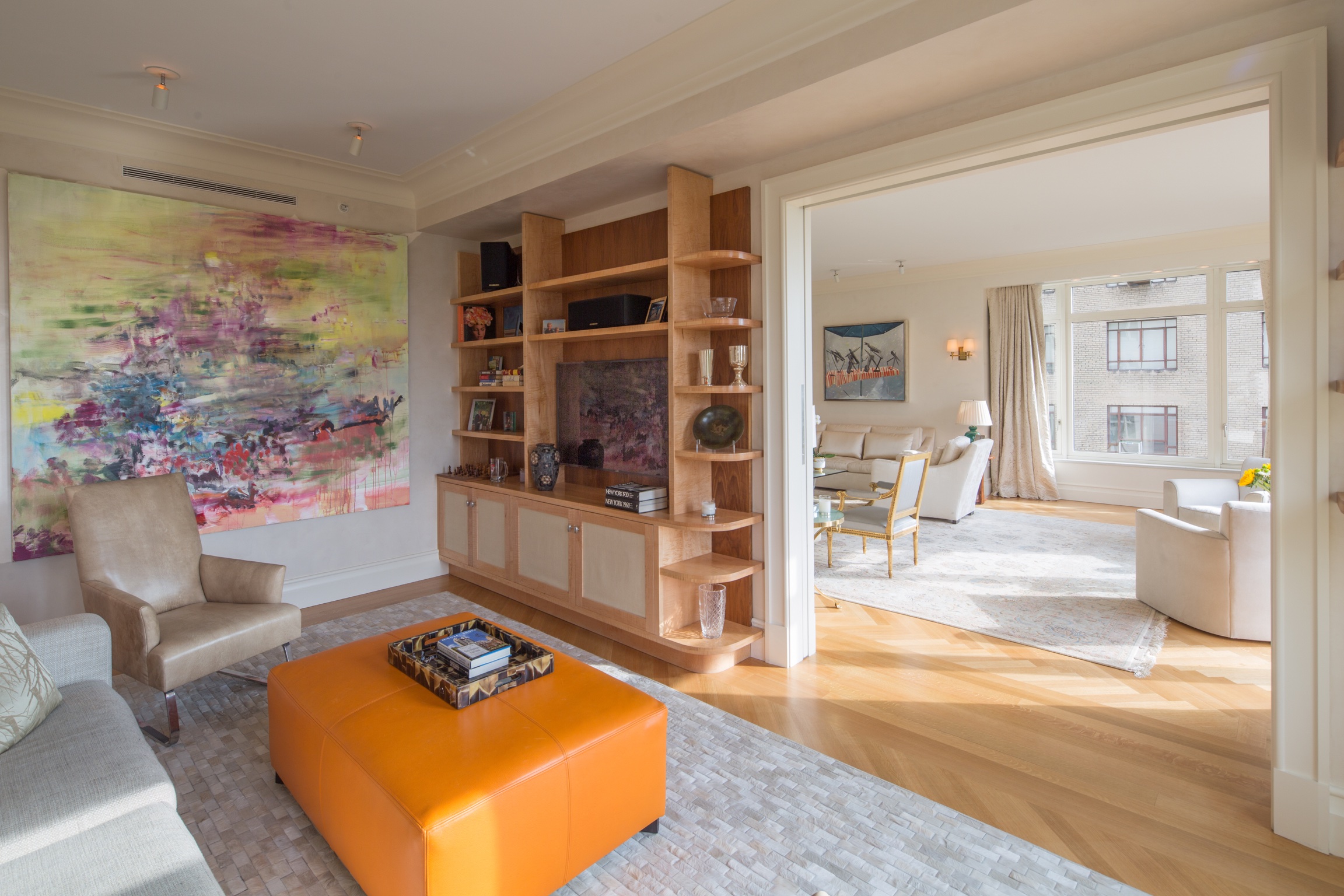 Custom furniture by Kevin Gray | Custom bookcases with two-tone woods, curved corners and raw silk fronts on lower cabinet