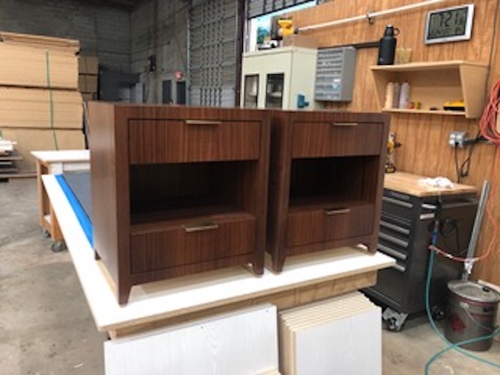 Custom nightstands in Indian rosewood and brushed brass edge pulls by Kevin Gray